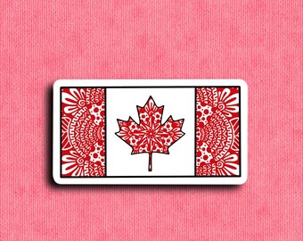 Puede incluir: Una pegatina de la bandera canadiense con una hoja de arce roja en el centro. La hoja está decorada con un patrón de mandala blanco y rojo. El fondo de la bandera es blanco con bordes rojos.
