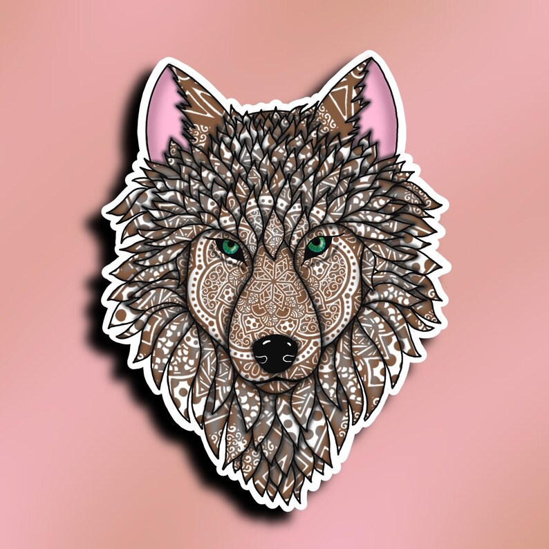 May include: A brown wolf's head with intricate mandala patterns in white and brown. The wolf has green eyes and pink ears.
