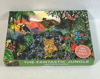 May include: A 500 piece jigsaw puzzle featuring a jungle scene with a leopard, toucan, monkey, and lush green foliage. The puzzle box has the text "The Fantastic Jungle 500 Piece Puzzle" on the front.