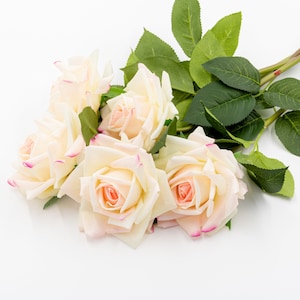 Artificial pink roses with real touch  Roses at the wedding
