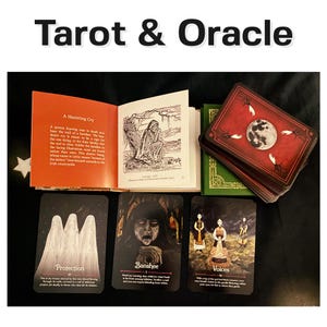 May include: A set of tarot and oracle cards with illustrations of a banshee, protection, and voices. The cards are on a dark surface with a book open to a page with the title "A Haunting Cry".