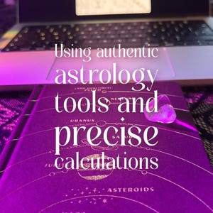 May include: A purple book with astrological symbols and text reading "Using authentic astrology tools and precise calculations." A laptop with a celestial chart is in the background. A clear crystal sits on the book.