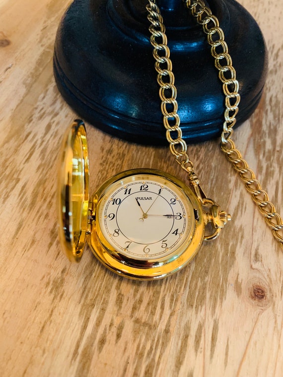 Pulsar pocket watch w/ chain, metal base, gold pla