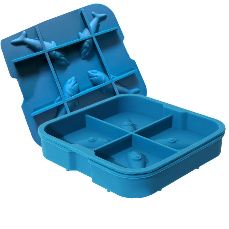 May include: A blue silicone ice cube tray with a lid featuring a grid design. The lid has four dolphin-shaped molds. The tray itself has four square molds, each with a dolphin design. The tray is designed for making ice cubes.