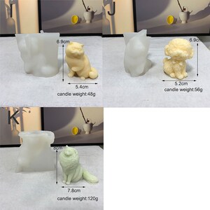 May include: Three silicone molds for making candles. The molds are shaped like a cat, a dog, and a tree. The molds are white and have measurements in centimeters and grams.