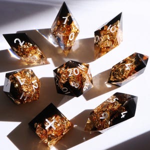 Brutus Crystal 8 pc Set - black and gold handmade resin sharp edge dnd dice set for DnD, D&D, Dungeons and Dragons, RPG dice, gold dice