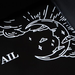May include: Black tray with a white crescent moon design, clouds, and stars. The word "FAIL" is printed in white on the tray.