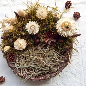 Nest for Easter table, nest of birch twigs with dried flowers, natural material, table decor.