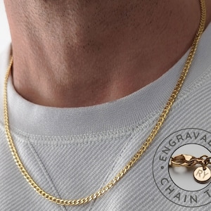 May include: A gold chain necklace with a small round tag that says "Engravable Chain Tag" and has the initials "RY" engraved on it.