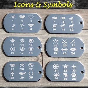 May include: Six gray metal dog tags with white icons and numbers. Each tag has six icons and numbers. The icons include a sun, heart, moon, heartbeat, a maple leaf, a steering wheel, a yin yang symbol, an infinity symbol, a peace sign, a compass, a baseball bat, hockey sticks, a basketball, a dumbbell, a football, a graduation cap, an axe, a globe, a cross, a wing, a horseshoe, a plus sign, a star, an airplane, a scorpion, a cactus, and a paw print.