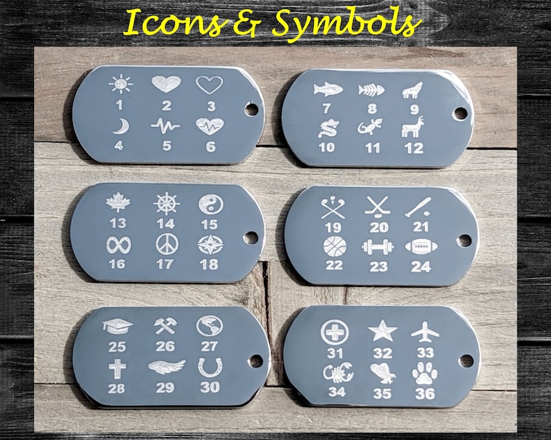 May include: Six gray metal dog tags with white icons and numbers. Each tag has six icons and numbers. The icons include a sun, heart, moon, heartbeat, a maple leaf, a steering wheel, a yin yang symbol, an infinity symbol, a peace sign, a compass, a baseball bat, hockey sticks, a basketball, a dumbbell, a football, a graduation cap, an axe, a globe, a cross, a wing, a horseshoe, a plus sign, a star, an airplane, a scorpion, a cactus, and a paw print.