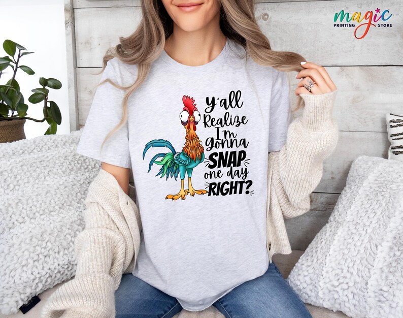 May include: A gray t-shirt with a cartoon rooster and the text "y'all realize I'm gonna snap one day right?"