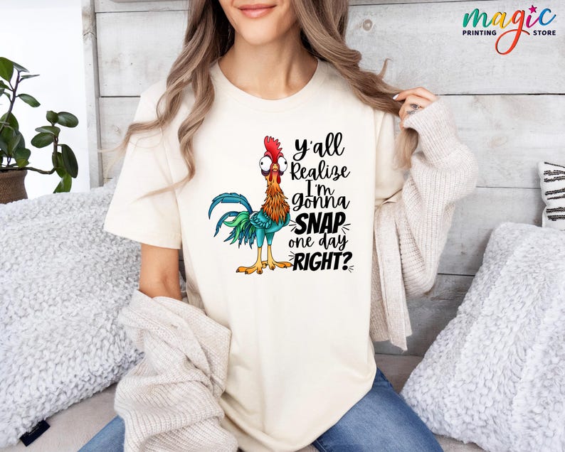 May include: A white t-shirt with a cartoon rooster and the text "y'all realize I'm gonna SNAP one day RIGHT?"