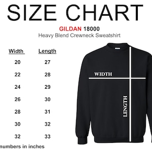 May include: Size chart for a Gildan 18000 heavy blend crewneck sweatshirt. The chart shows the width and length in inches for sizes S through 4XL.