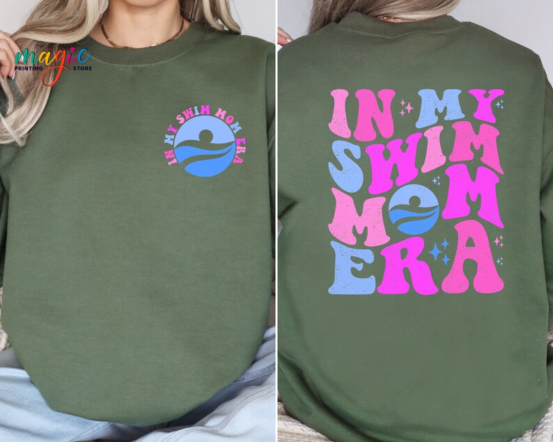 May include: A green sweatshirt with the text "In My Swim Mom Era" in pink and blue lettering with a swimmer graphic. The text is in a retro font.