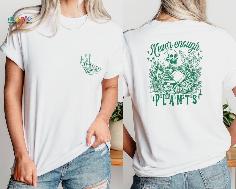May include: White t-shirt with a green skeleton holding a watering can surrounded by plants and the text "Never enough plants".