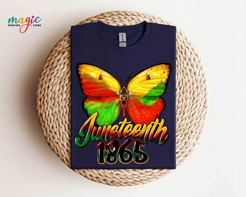 May include: A navy blue t-shirt with a colorful butterfly graphic and the text "Juneteenth 1865".