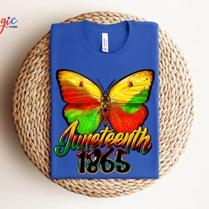 May include: A royal blue t-shirt with a colorful butterfly graphic and the text "Juneteenth 1865".