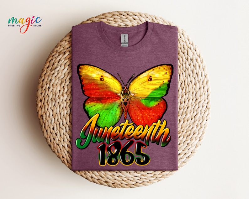 May include: A purple t-shirt with a colorful butterfly graphic and the text "Juneteenth 1865".