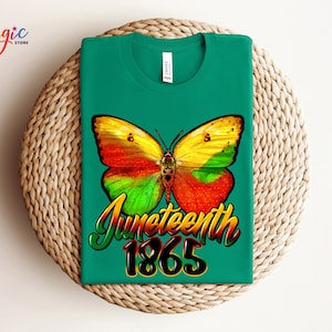 May include: Green t-shirt with a colorful butterfly graphic and the text "Juneteenth 1865".