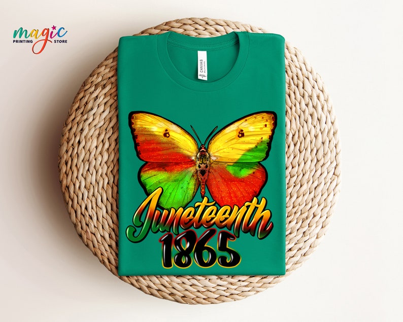 May include: Green t-shirt with a colorful butterfly graphic and the text "Juneteenth 1865".