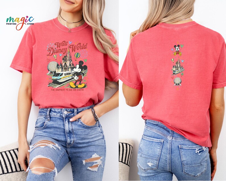 May include: Red t-shirt with a Walt Disney World graphic on the front, showing Mickey Mouse, a train, and a castle. The back has a smaller graphic with Mickey Mouse and Disney World icons. The front text reads "Walt Disney World" and "The Happiest Place on Earth."