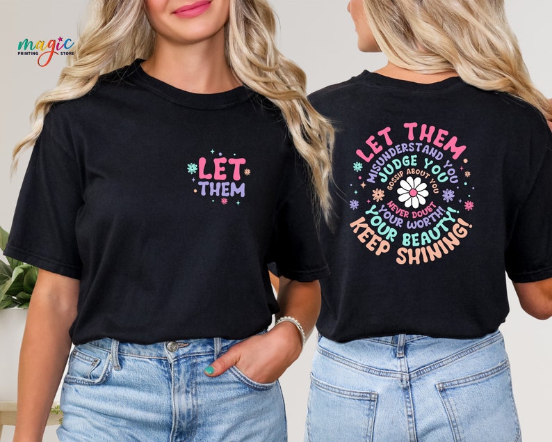 May include: Two black t-shirts with a graphic print of flowers and text. The front shirt says "Let Them" and the back shirt says "Let Them Misunderstand and Judge You Gossip About You Never Doubt Your Worth Keep Shining Your Beauty!"