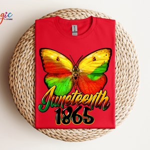 May include: Red t-shirt with a colorful butterfly graphic and the text "Juneteenth 1865".