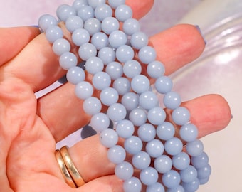Pulsera de cuentas de angelita de 6 mm: cristal azul calmante para la serenidad y la comunicación.