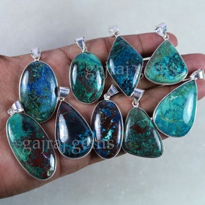 May include: Assortment of nine turquoise and brown gemstone pendants with silver settings. The pendants are in various shapes, including oval, teardrop, and diamond.