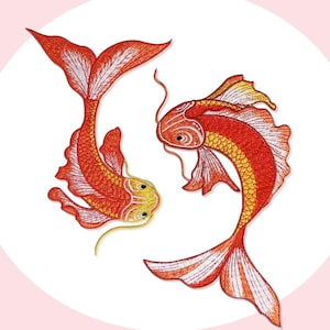 May include: Embroidered design featuring two koi fish in shades of red, orange, and yellow. The fish are depicted in a stylized, flowing manner, with detailed stitching creating scales and fins. The design is set against a soft pink background.