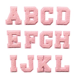 May include: A selection of pink, fluffy, varsity-style letter patches. The letters A to L are shown against a white backdrop. Each letter has a thick, textured appearance, ideal for customising clothing or accessories.