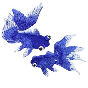 May include: Two embroidered patches depicting blue goldfish with white-edged fins and prominent eyes. The fish are intricately stitched, giving a textured, three-dimensional appearance. Perfect for customising garments or accessories with a unique design.