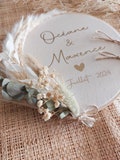 ring bearer pillow with eucalyptus and white flower wreath product logo
