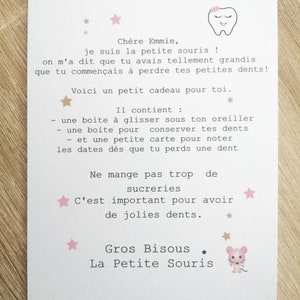 May include: A pink and white card with a tooth illustration and stars. The card has a message for a child who is losing their baby teeth. The message says "Ch&egrave;re Emmie, je suis la petite souris! On m'a dit que tu avais tellement grandis que tu commen&ccedil;ais &agrave; perdre tes petites dents! Voici un petit cadeau pour toi. Il contient: - une bo&icirc;te &agrave; glisser sous ton oreiller - une bo&icirc;te pour conserver tes dents - et une petite carte pour noter les dates d&egrave;s que tu perds une dent. Ne mange pas trop de sucreries C'est important pour avoir de jolies dents. Gros Bisous ★ La Petite Souris"