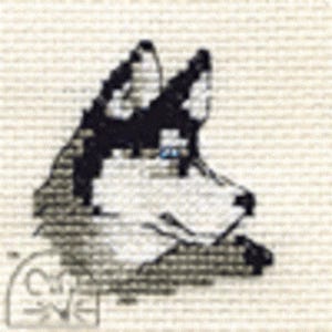 May include: A cross-stitch depiction of a dog's head in profile, rendered in black and white. The dog's ears and facial details are prominent against a plain backdrop. A signature is visible in the bottom left corner of the design.