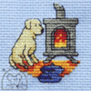 May include: Cross-stitch design showing a yellow Labrador Retriever beside a stone fireplace with a red and yellow fire. A blue pot is in front of the fireplace. The background is light blue.