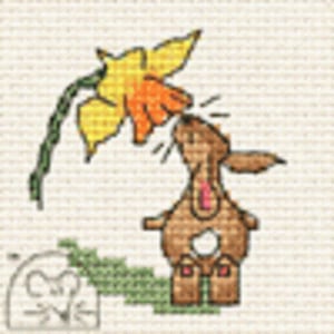 May include: Cross-stitch design of a brown bunny sniffing a yellow and orange daffodil. The bunny has a pink chest and is positioned beneath the flower. A small mouse is also present in the design, along with green foliage.