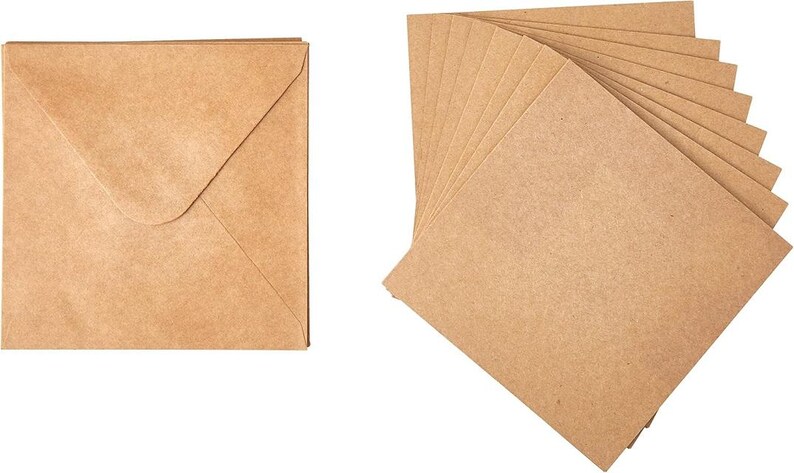 May include: A square, kraft paper envelope with a flap closure is shown next to a stack of matching square cards. The paper has a natural, light brown color and a slightly textured surface. The cards are fanned out, displaying their edges.