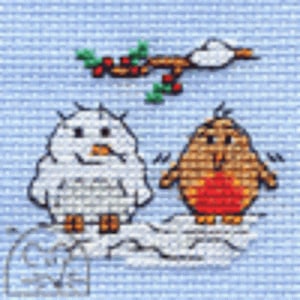 May include: Cross-stitch image of two birds, one white and one brown with a red breast, on a cloud. A branch with red berries and green leaves is above them, set against a light blue background.