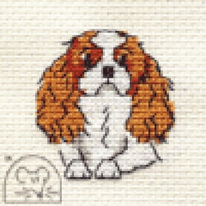 May include: A pixelated image of a Cavalier King Charles Spaniel dog. The dog has a white chest and face with brown and orange fur. The background is a light beige brick pattern. A small, blurry image of a dog is in the lower left corner.