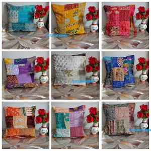 May include: Nine different patchwork kantha throw pillow covers in various colors and patterns. The pillows are all square and have a quilted design. The pillows are arranged in a grid pattern on a brown surface.