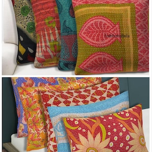 Könnte beinhalten: Eine Sammlung von quadratischen und rechteckigen Zierkissen mit Kantha-Stickerei und verschiedenen Mustern wie Blumen, geometrischen Formen und Fischmotiven in leuchtenden Farben wie Rot, Grün, Blau und Gelb, mit dem Text CraftsCentralIndia.