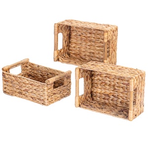 May include: Three rectangular woven baskets with bamboo handles. The baskets are made of a light brown, natural material and are arranged at different angles, showcasing their design and texture. The handles are a lighter shade of brown.