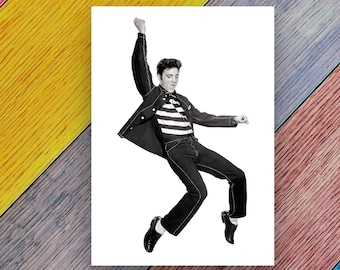 May include: A black and white photo of a man in a striped shirt and a jacket, jumping in the air with his arms raised.