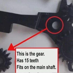 May include: A black plastic gear assembly featuring a separate small gear with 15 teeth. A red arrow points from a circular opening on the main assembly to the small gear. Text on the image reads: This is the gear. Has 15 teeth. Fits on the main shaft.