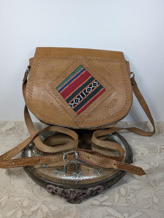 Handmade leather saddle bad, hand-woven textile.