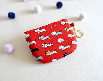 Monedero con estampado de gato rojo, estuche de tela con cremallera y llavero.
