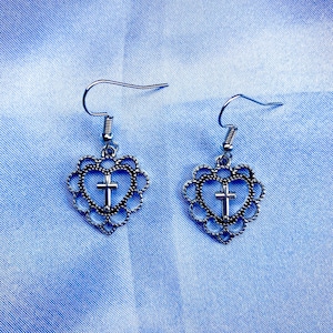 Pretty cool grunge emo goth alternative metal cross in a heart earrings