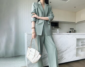 female suit wedding guest